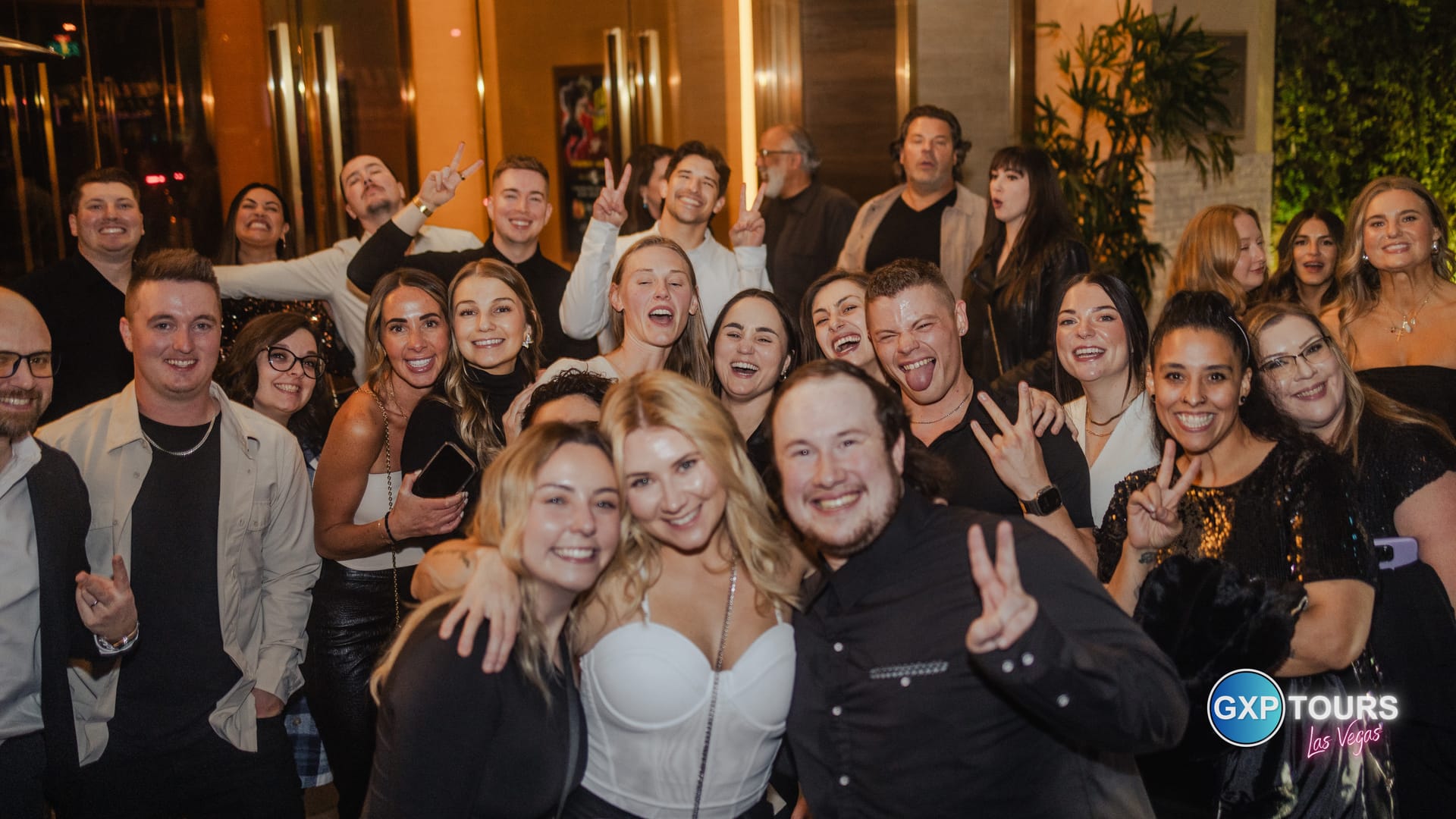 Company team celebrating together outside a Las Vegas venue at night on a GXP Tours private night out